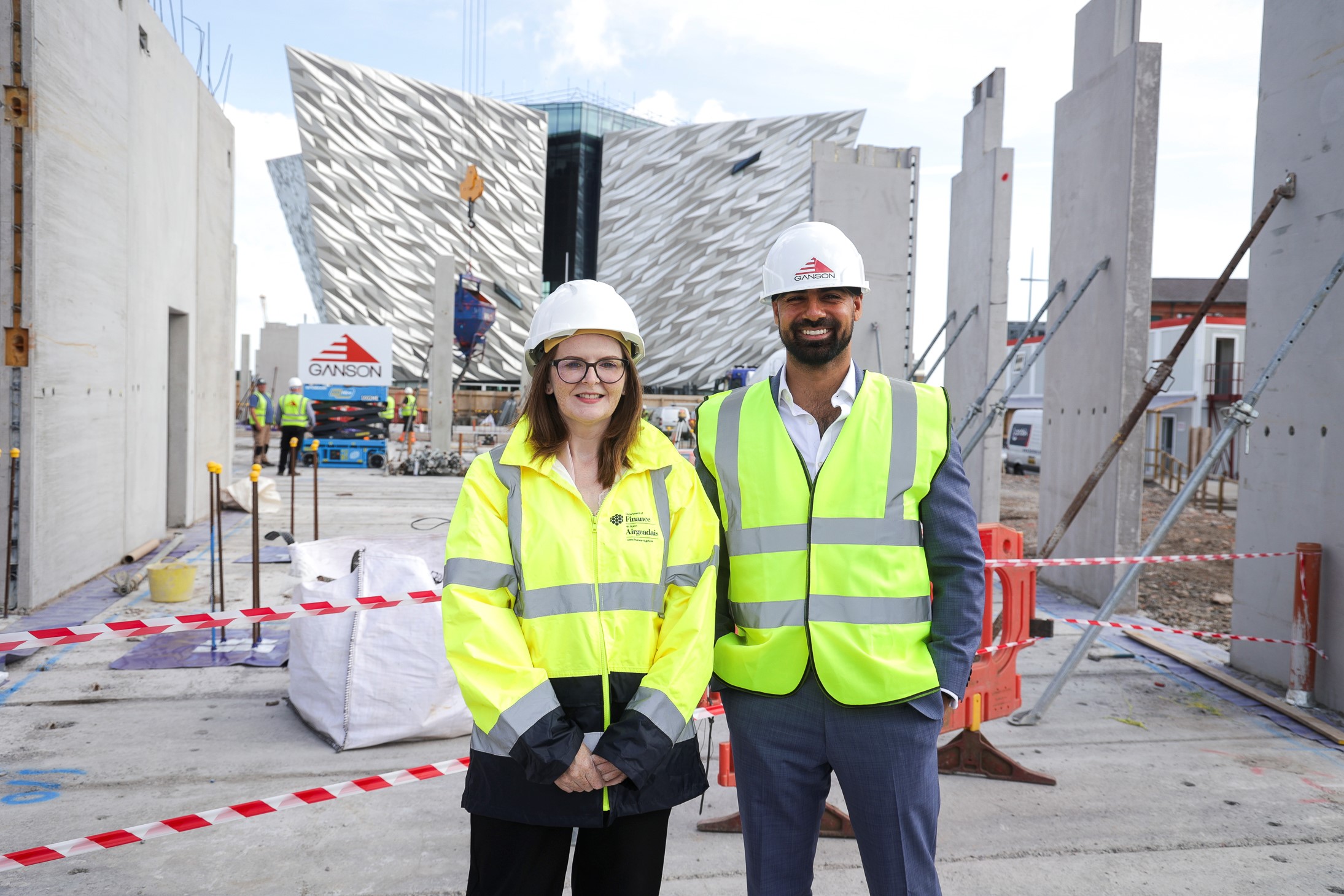 Picture of Minister and Zain Kajani in front of Titanic Belfast building.