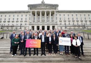 Ministers and MLAs pictured with representatives of  Causeway Coast and Glens and Mid South West Growth Deals