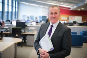 Finance Minister Conor Murphy in office environment